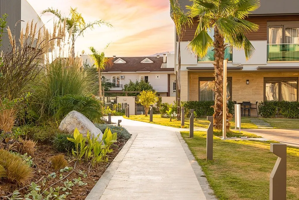 Garden path between hotel villas at sunset in Antalya