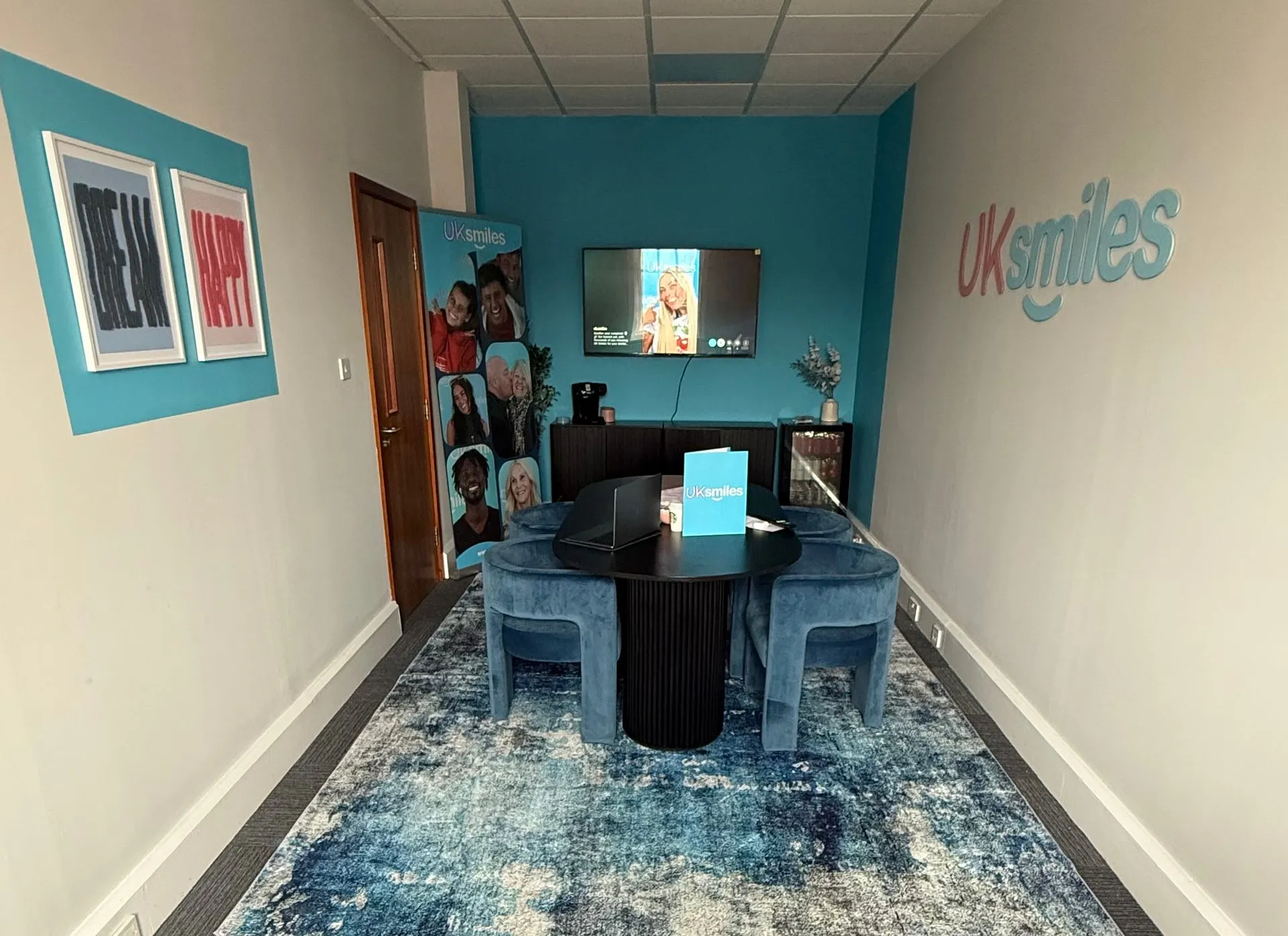 The UK Smiles consultation room in Leeds, with the table, chairs and smile design displays where patients plan their Turkey treatment